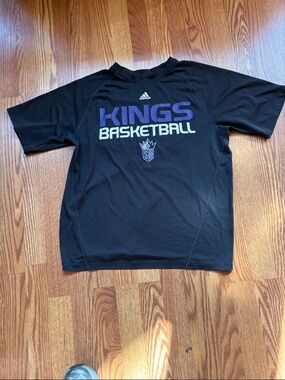 Adidas  Black Woman’s Sacramento Kings Basketball Tee with Purple & White Logo